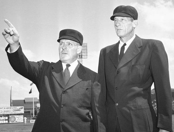 Deadspin offers a pictorial history of why umpires wear suits.