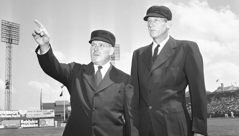 Deadspin offers a pictorial history of why umpires wear suits.